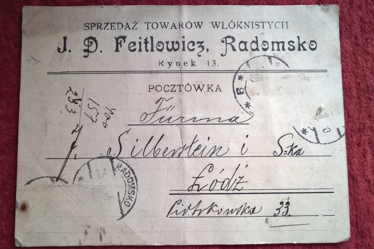 Pocztówka reklamowa z Radomska – sprzedaż towarów włóknistych J. D. Feitlowicz